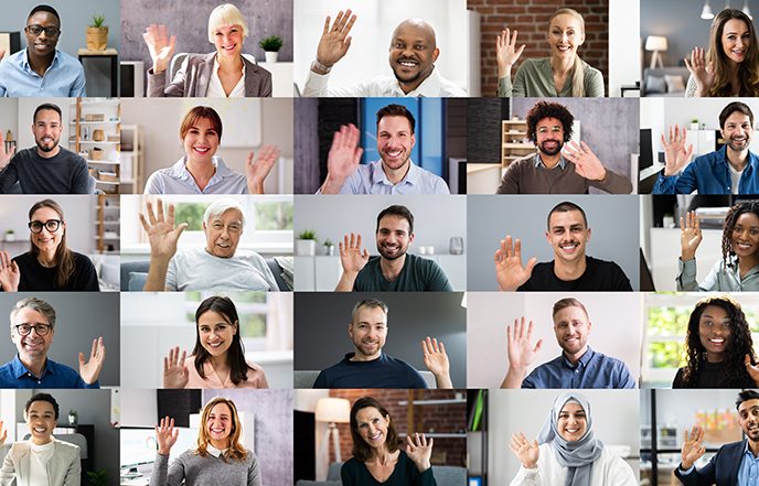 Diverse group of staff waving to eachother on an online meeting