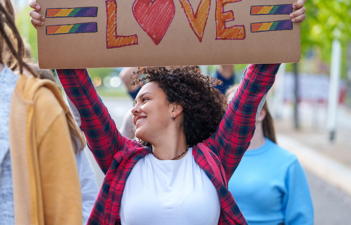 Woman holding love sign