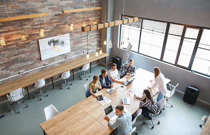 digital studio staff collaborating at conference table