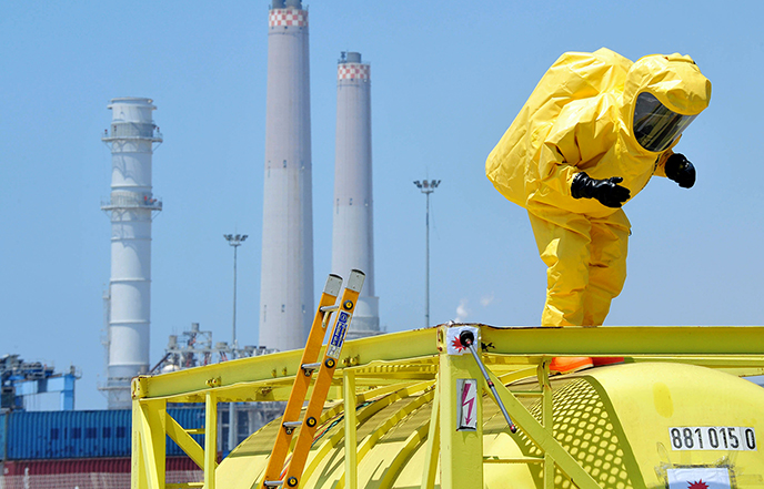 Human in nuclear chemical protection suit